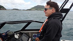 New boatie Thomas learning to operate the boat safely and navigate using chart plotter and compass