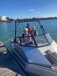 The Kogler family from Germany preparing for a fishing trip on Tauranga Harbour.